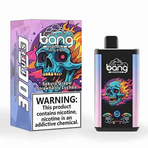 Bang 30K Pro disposable vape and box with flaming-skull artwork; flavor &ldquo;Sakura Grape / Strawberry Lychee,&rdquo; 30,000-puff branding, and a large nicotine warning.